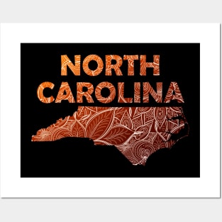 Colorful mandala art map of North Carolina with text in brown and orange Posters and Art